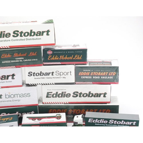 687 - Sixteen Atlas Edition Eddie Stobart haulage lorries and a CD, all boxed, eleven sealed