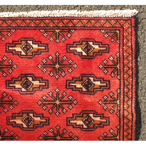 2078 - Rectangular Turkman carpet runner, having an all over repeat gull design onto a red ground, 332cm x ... 