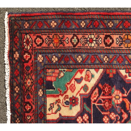 2033 - Rectangular Hamadan rug, having an all over stylised floral design within corresponding borders, ont... 