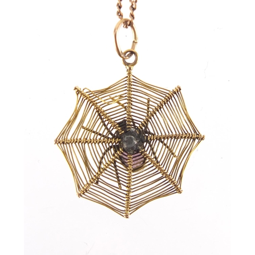 2666 - Unmarked gold spider on a web pendant with amethyst body, on a 9ct gold necklace, the pendant 2.8cm ... 