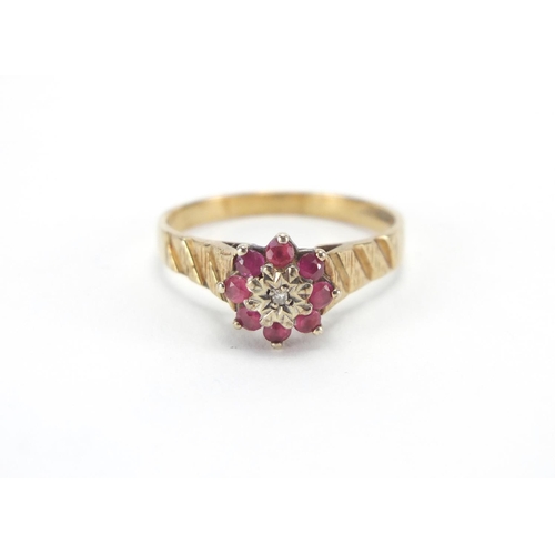 2696 - 9ct gold diamond and pink stone flower head ring, size Q, approximate weight 2.8g