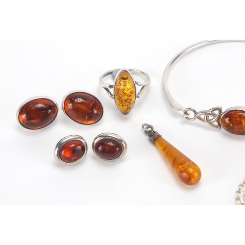 2709 - Silver and amber jewellery including two pendants, bracelet, ring and two pairs of earrings, approxi... 