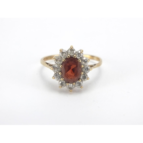 2646 - 9ct gold garnet and clear stone ring, size M, approximate weight 2.0g