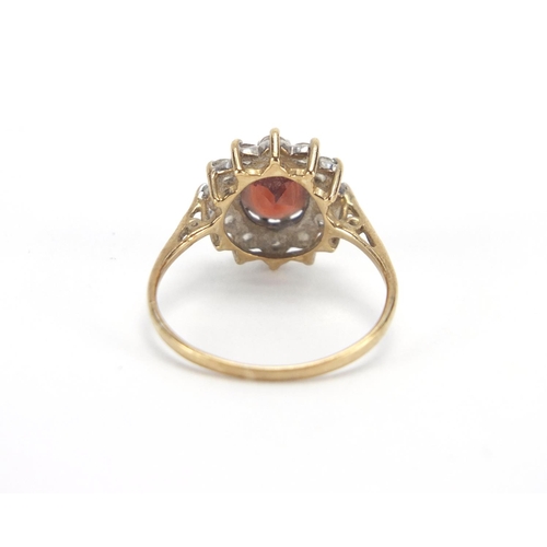 2646 - 9ct gold garnet and clear stone ring, size M, approximate weight 2.0g