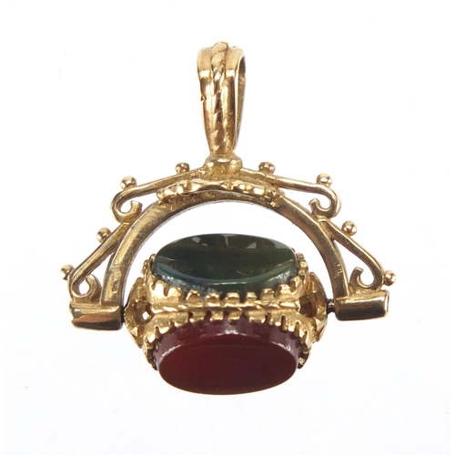 2604 - 9ct gold hardstone spinner fob, 2.5cm in length, approximate weight 4.0g