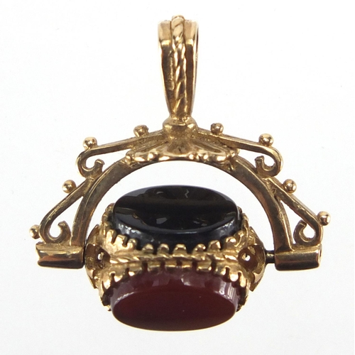 2604 - 9ct gold hardstone spinner fob, 2.5cm in length, approximate weight 4.0g