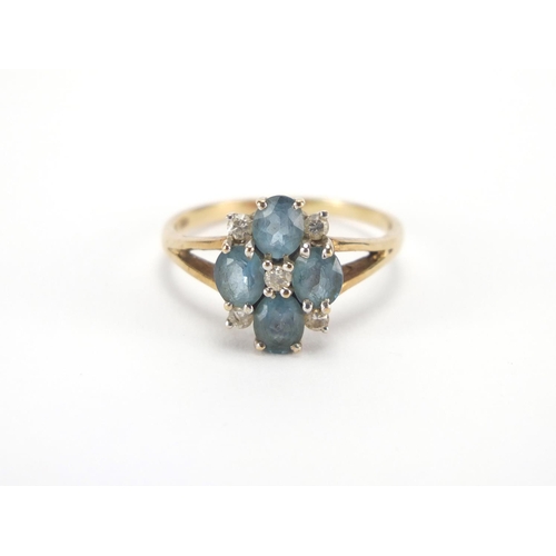 2710 - 9ct gold blue stone and diamond flower head ring, size Q, approximate weight 2.8g