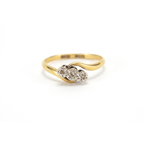 2616 - 18ct gold diamond three stone crossover ring, size P, approximate weight 2.3g