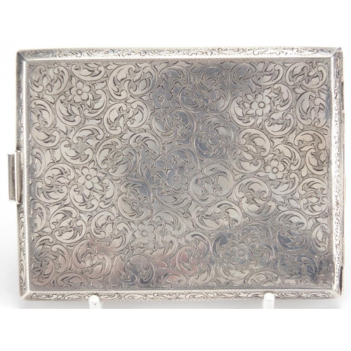 2562 - Rectangular 900 grade silver cigarette case, with floral chased decoration, 11cm x 8cm, approximate ... 