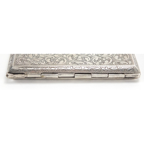 2562 - Rectangular 900 grade silver cigarette case, with floral chased decoration, 11cm x 8cm, approximate ... 