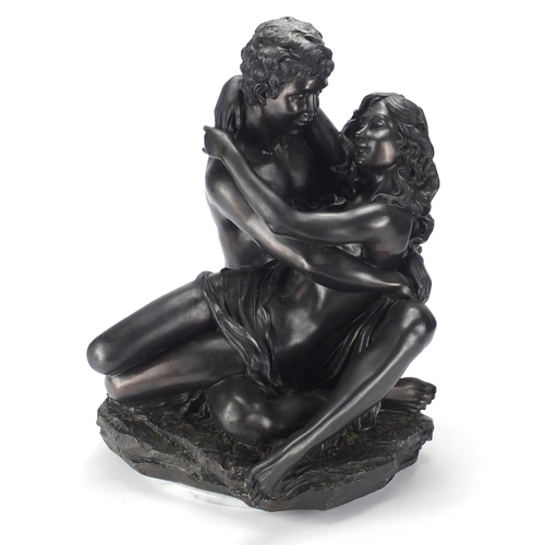 2155 - Bronzed figure group of two semi nude bathers, on a circular white marble style base, 50cm high