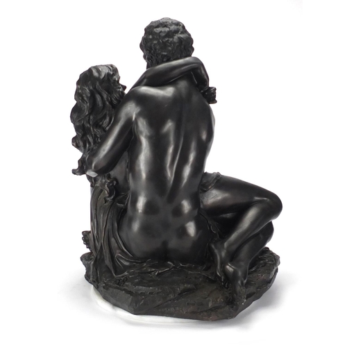 2155 - Bronzed figure group of two semi nude bathers, on a circular white marble style base, 50cm high