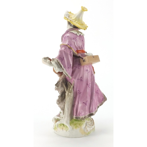 2174 - Continental porcelain figure playing a banjo, hand painted with flowers, 32.5cm high