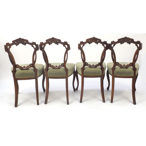 23 - Set of four Victorian carved mahogany chairs, with green stuffover seats