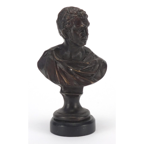 2182 - Patinated bronze bust of a classical gentleman on circular black marble style base, 16cm high