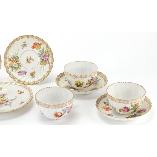 2202 - Dresden fluted teaware hand painted with flowers, including trio's, the cups 5cm high