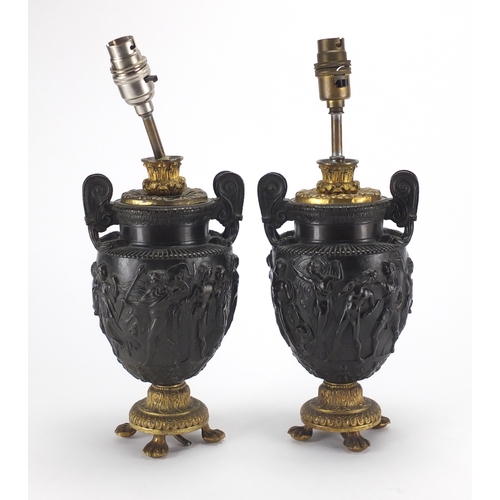 2231 - Pair of classical bronze vase desk lamps, with twin handles, each cast in relief with a continuous b... 