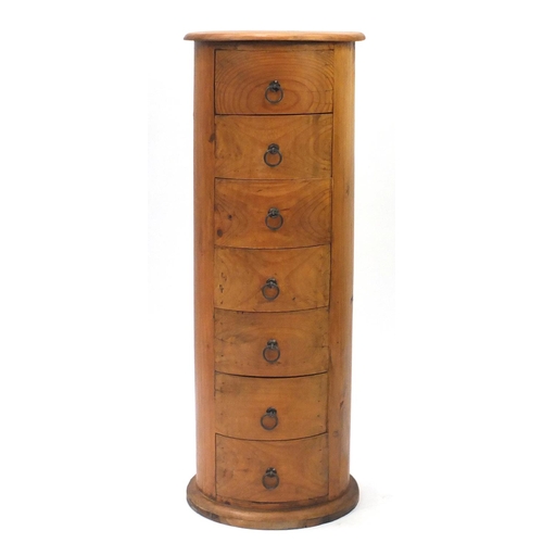 7 - Cylindrical pine seven drawer chest, 121cm high x 45cm in diameter