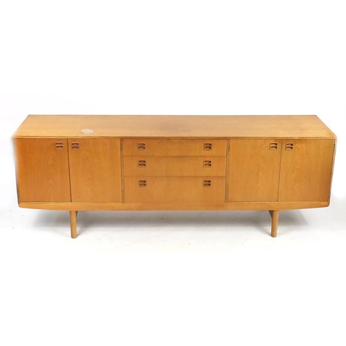 2047 - Vintage Scottish teak sideboard by Beithcraft, fitted with two pairs of cupboard doors and three cen... 