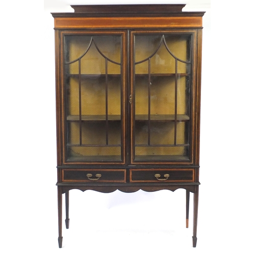4 - Edwardian inlaid mahogany china cabinet, fitted with a pair of glazed doors above two drawers, raise... 