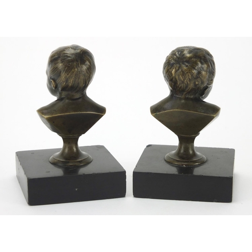 50 - Pair of 19th century bronze and black slate paperweights each with busts of young children, each 11c... 