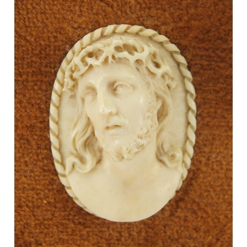 11 - 19th century carved ivory cameo of Christ, housed in a carved gilt wood frame, overall 31.5cm x 17cm