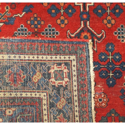 646 - Persian Joshagan rug with central medallion onto a red ground, 200cm x 132cm