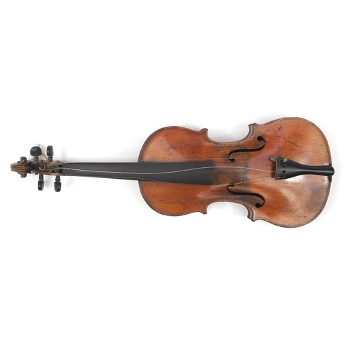 131 - Old wooden violin with scrolled neck, bow and fitted carrying case, the violin back 15 inches in len... 