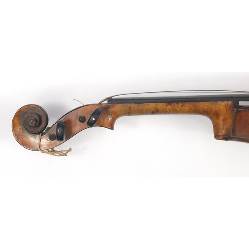 131 - Old wooden violin with scrolled neck, bow and fitted carrying case, the violin back 15 inches in len... 