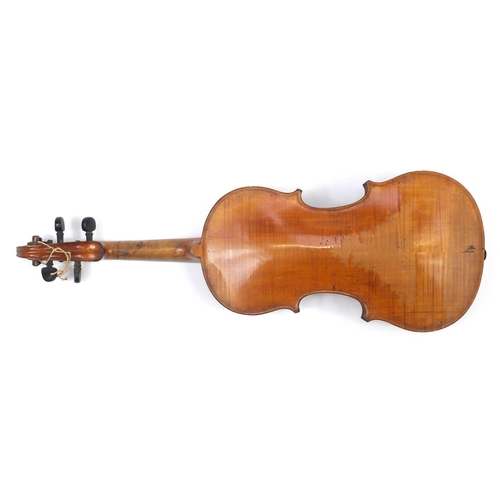 131 - Old wooden violin with scrolled neck, bow and fitted carrying case, the violin back 15 inches in len... 