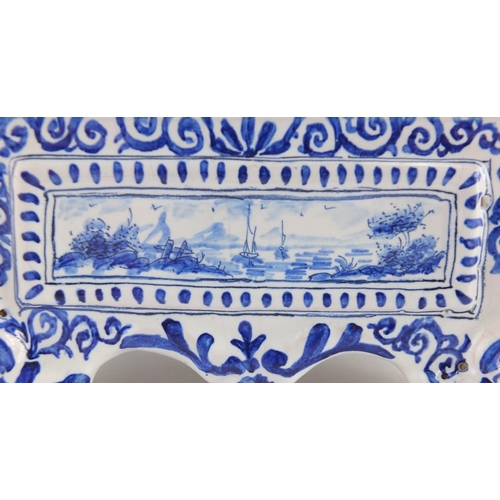 731 - Delft pottery mantel clock, hand painted with Dutch landscape, the dial with Arabic numerals, painte... 