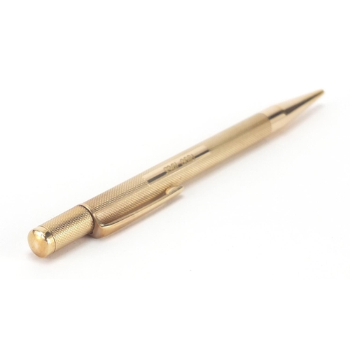 122 - 9ct gold propelling pencil, with engine turned body by C & C, 12cm in length, approximate weight 22.... 