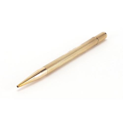 122 - 9ct gold propelling pencil, with engine turned body by C & C, 12cm in length, approximate weight 22.... 