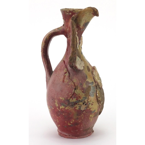 597 - Antique Ottoman Canakkale wine jug, with applied floral design, 28cm high