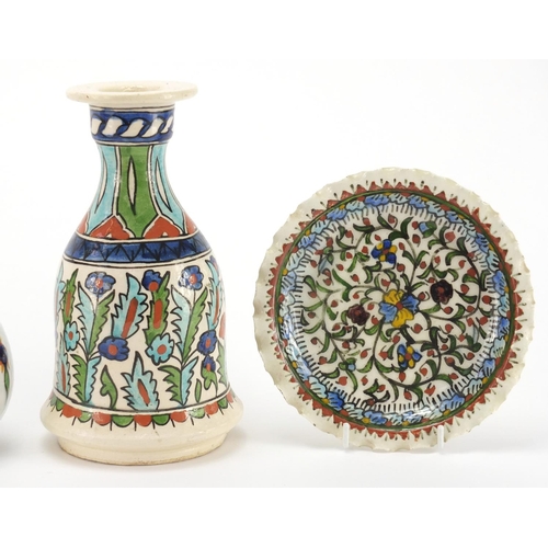 599 - Turkish Kütahya pottery, hand painted with stylised flowers comprising rose water vase, Hooka Base a... 