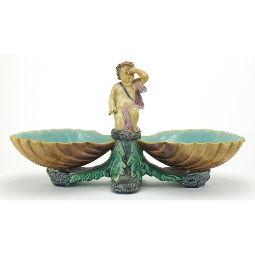 733 - Victorian Majolica centrepiece dish with putti design, impressed marks to the base, 22cm high x 41cm... 