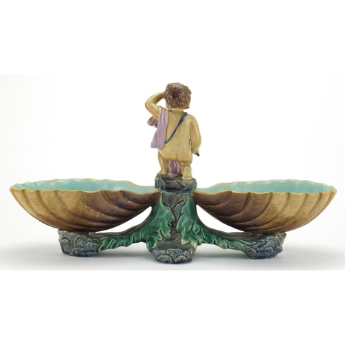 733 - Victorian Majolica centrepiece dish with putti design, impressed marks to the base, 22cm high x 41cm... 