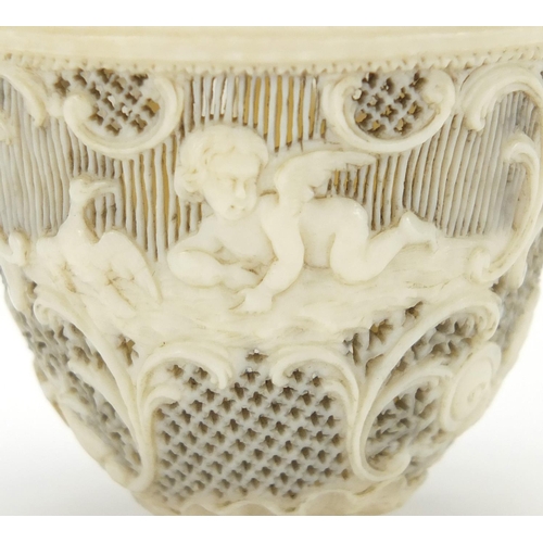12 - 19th century European ivory trinket, finely pierced and carved with Cupids and flowers amongst C scr... 