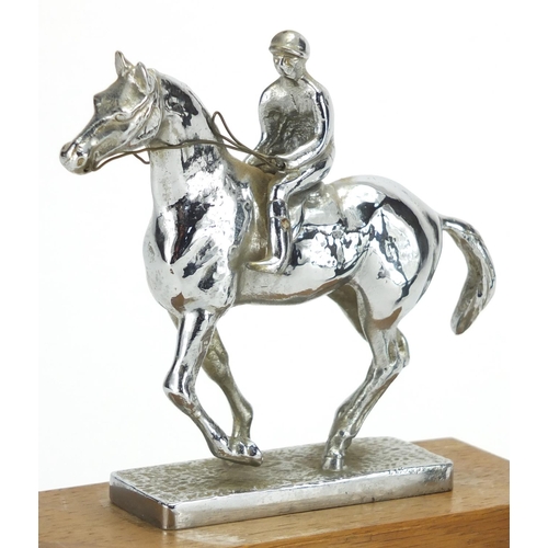 137 - Two vintage car mascots including a chrome jockey on horseback example, the largest 17cm high