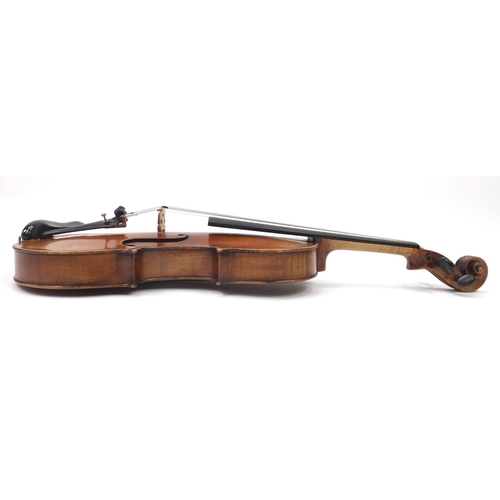 130 - Old wooden violin with one piece back and scrolled neck, stamped Duke London, with two bows and prot... 