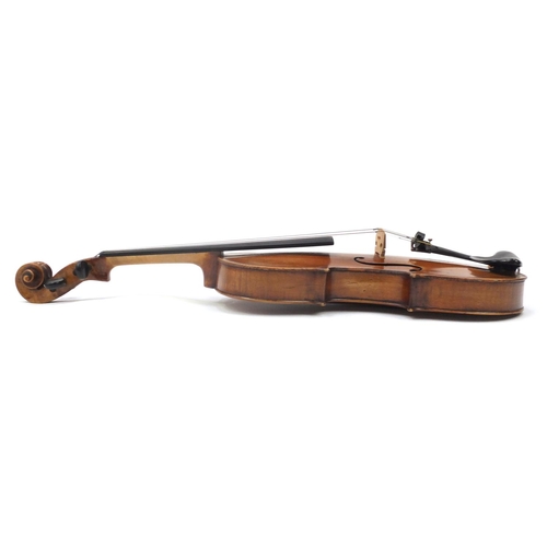 130 - Old wooden violin with one piece back and scrolled neck, stamped Duke London, with two bows and prot... 