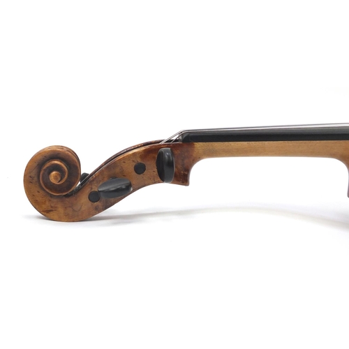 130 - Old wooden violin with one piece back and scrolled neck, stamped Duke London, with two bows and prot... 