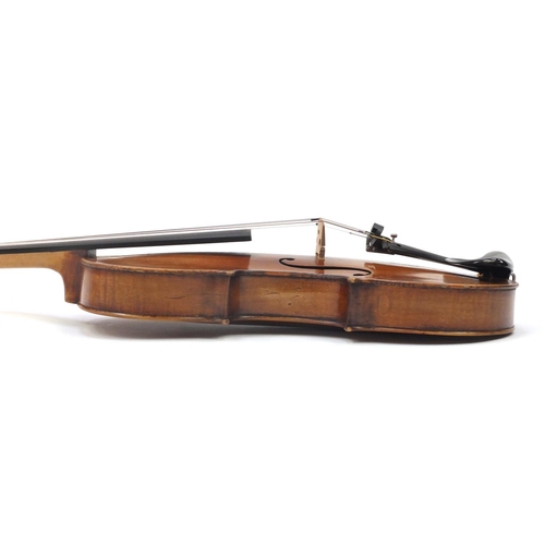 130 - Old wooden violin with one piece back and scrolled neck, stamped Duke London, with two bows and prot... 