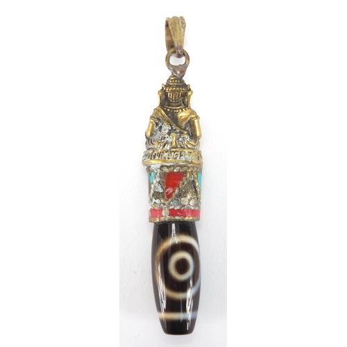 609 - Tibetan brass and stone pendant set with coral and turquoise, 8cm in length