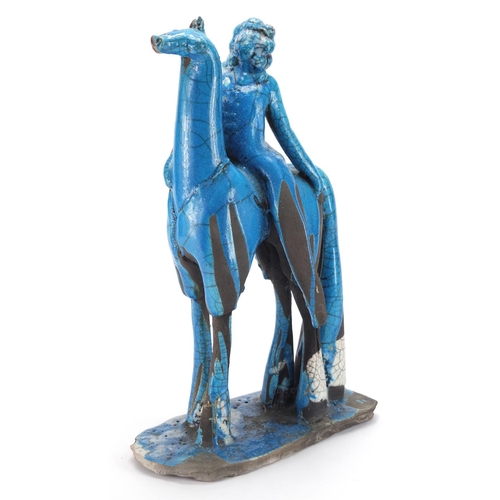 600 - Middle Eastern blue glazed pottery study of a figure on horseback, 42cm high