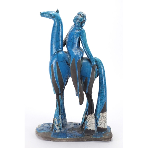 600 - Middle Eastern blue glazed pottery study of a figure on horseback, 42cm high