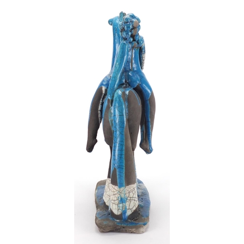 600 - Middle Eastern blue glazed pottery study of a figure on horseback, 42cm high