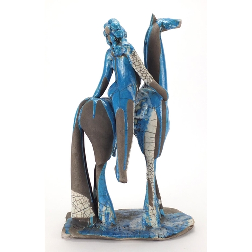 600 - Middle Eastern blue glazed pottery study of a figure on horseback, 42cm high