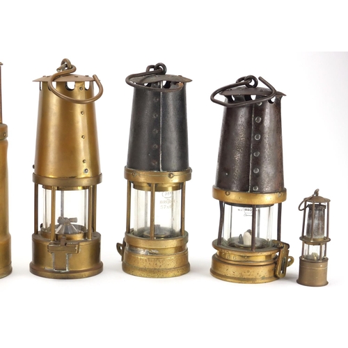 87 - Nine miners lamps including two Eccles, Oldham Type and J H Naylor, various impressed marks, the lar... 