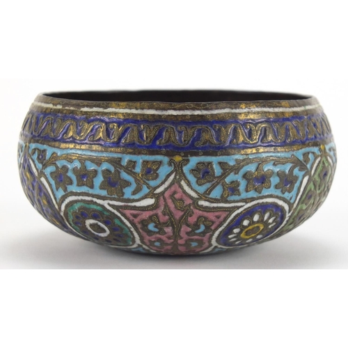 579 - Islamic copper bowl, enamelled with flowers amongst foliate motifs, 11cm in diameter